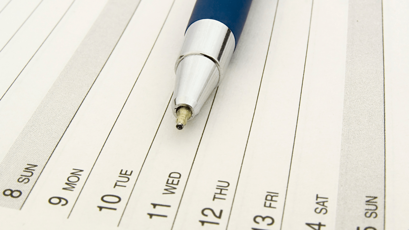 An image of a blue pen placed on a page of a diary - Country Heat - The home of Wood Burning & Multifuel Stoves
