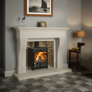 FDC 8 Eco Multifuel Stove in room setting with fireplace surround
