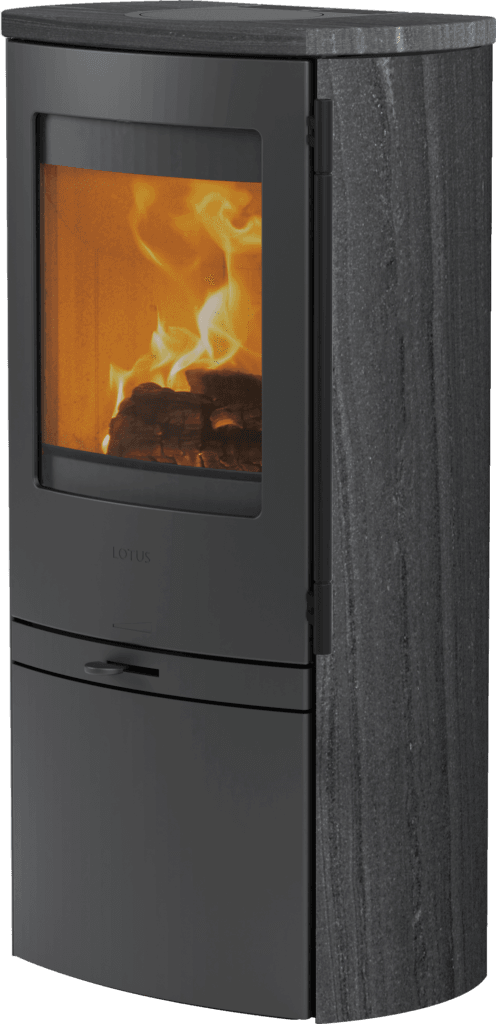 The Lotus Jubilee 20 Complete Indian Night stone wood stove burns logs behind a glass door, with a compact design and dark textured cladding.
