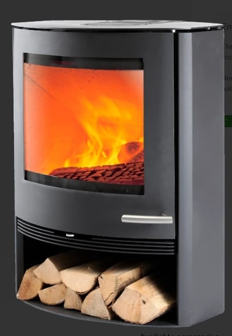 Modern wood stove with a glass front displaying flames and a storage area for logs underneath.