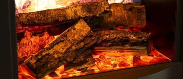 Glowing logs and lifelike flames in the Parkray Aspect 5 Pure Flame Electric Stove create a warm, realistic fire effect with ember bed lighting.